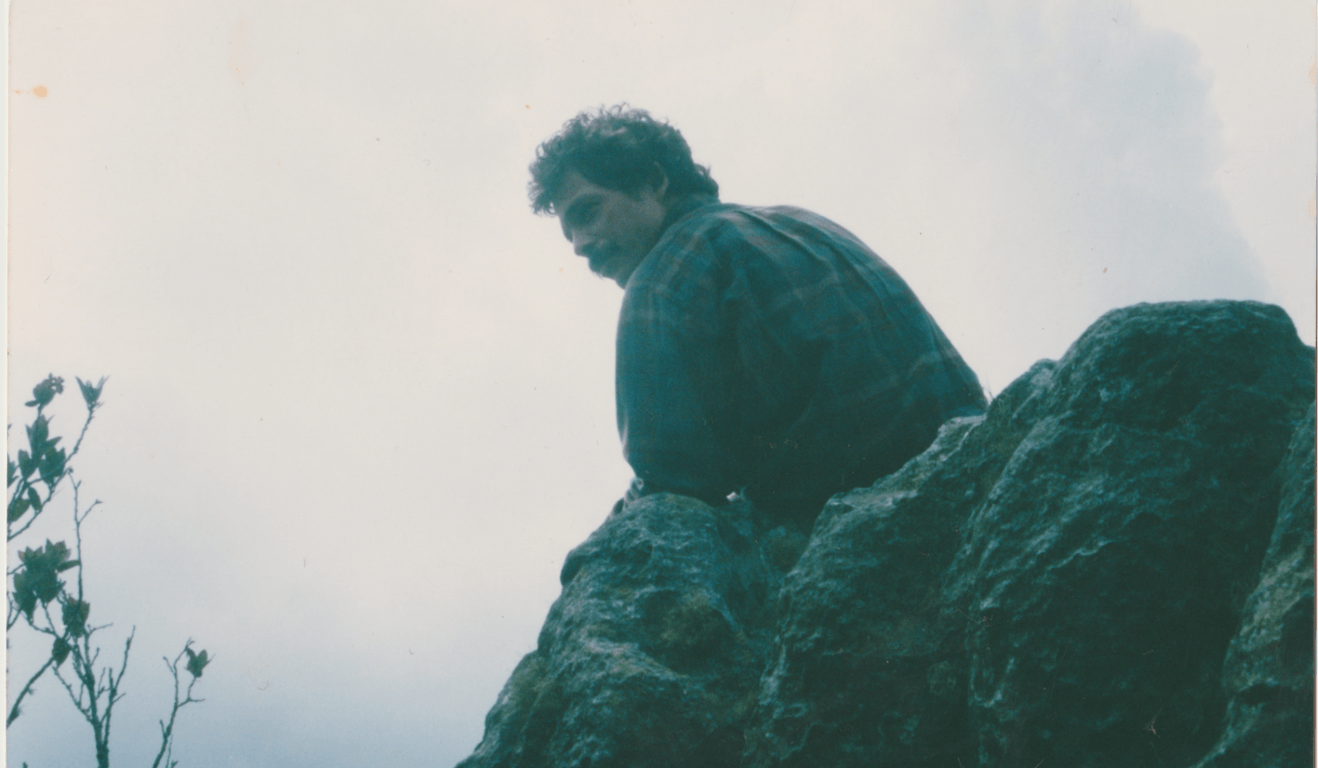 Person standing on rocky terrain in the Colombian páramo.